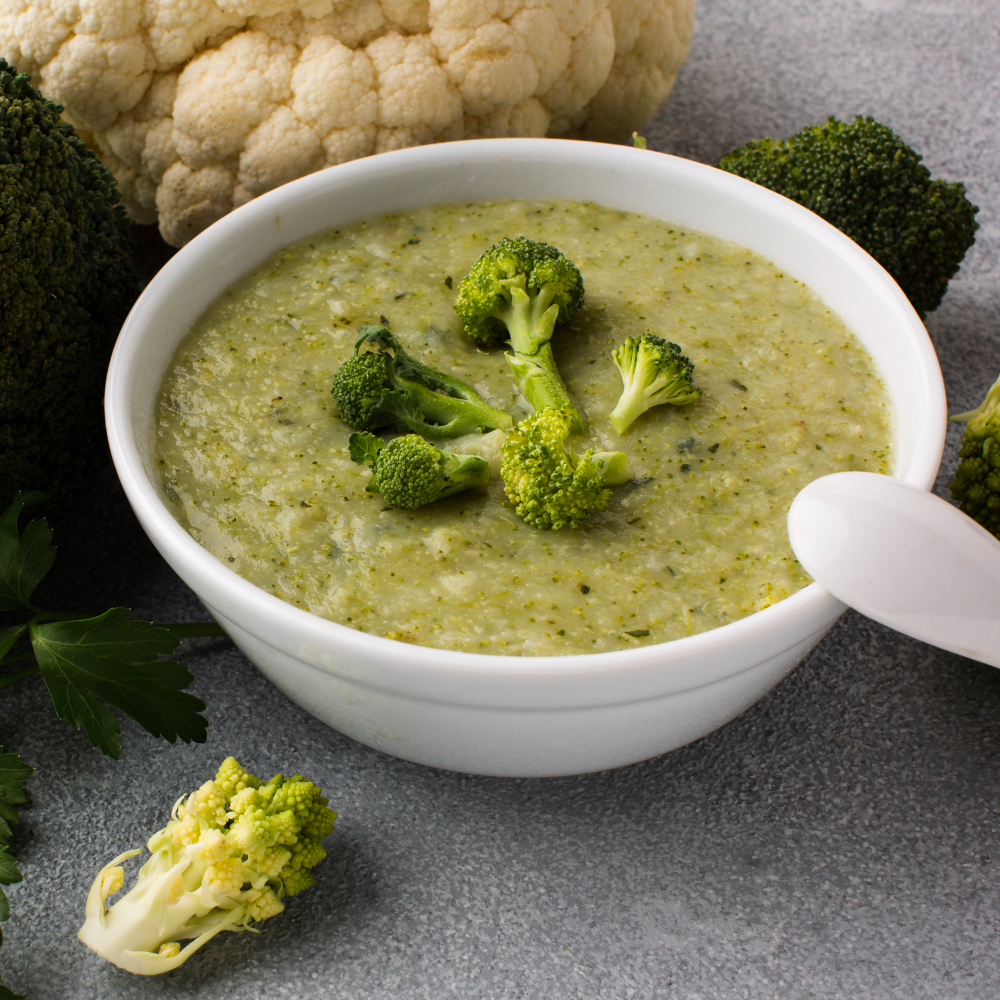 High angle broccoli and cauliflower vegetables and bisque.
